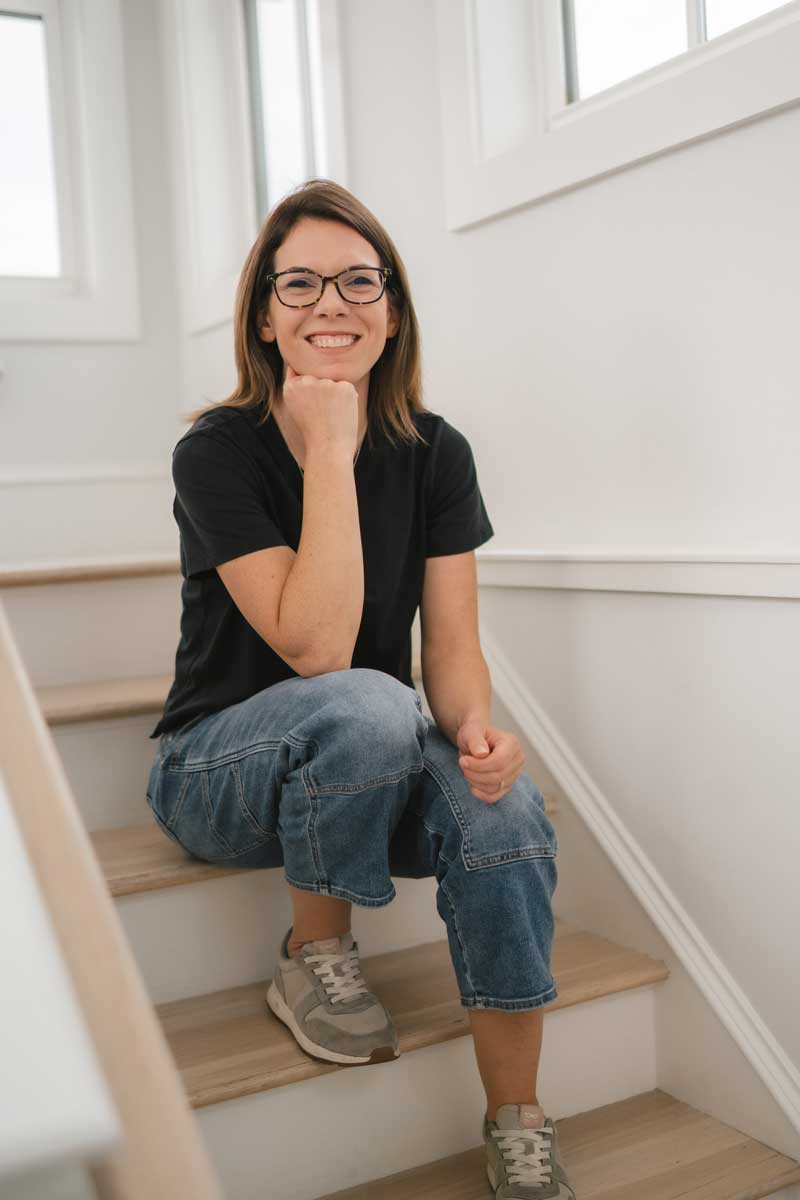Business woman and man working on a laptop project holding coffee mugs